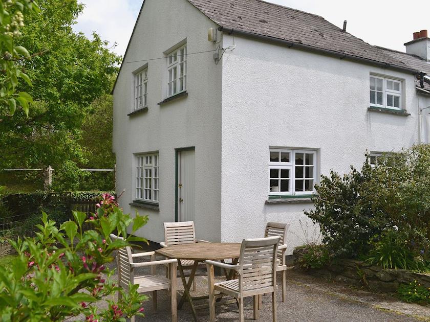 Small enclosed lawned garden with patio area and garden furniture | Orchard Cottage - Valleybrook Holidays, Polperro