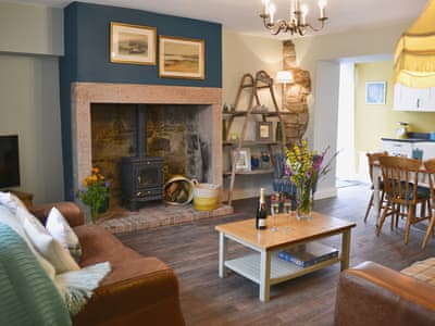 Lounge area with wood burner | Rose Cottage, Beadnell