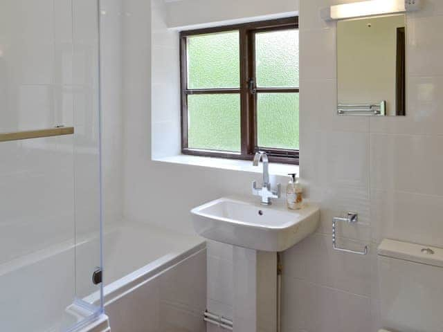 Family bathroom with shower over bath | The Granary - White House Farm Holiday Cottages, Knapton, near North Walsham