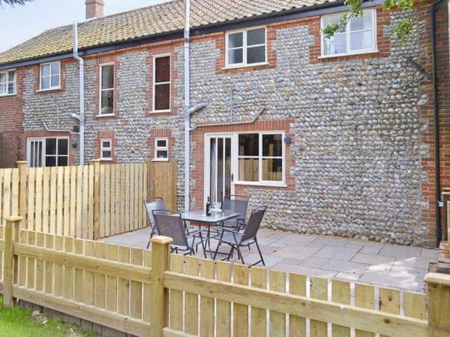 Enclosed patio to rear | The Granary - White House Farm Holiday Cottages, Knapton, near North Walsham