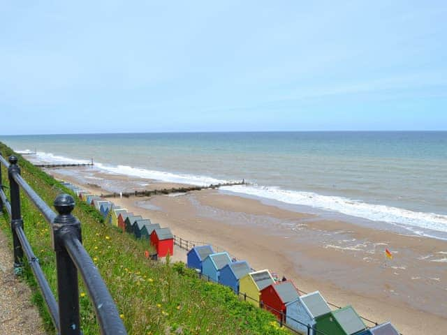 The coastline with beach-huts | The Granary - White House Farm Holiday Cottages, Knapton, near North Walsham