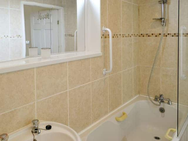 Bathroom with shower over bath | Stable Cottage - Border Forest Cottages, Cottonshopeburnfoot, near Otterburn