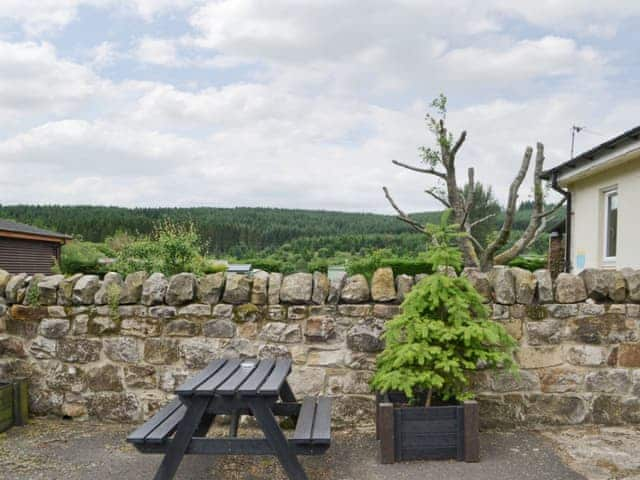 Great rural views from courtyard | Stable Cottage - Border Forest Cottages, Cottonshopeburnfoot, near Otterburn