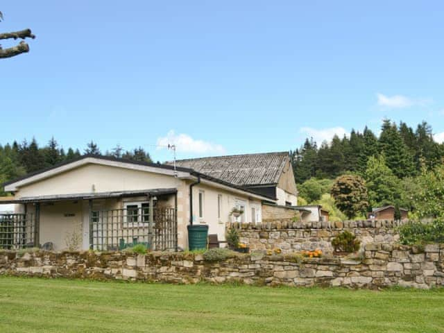 Holiday home viewed from lawned garden | Fir Tree Cottage - Border Forest Cottages, Cottonshopeburnfoot, near Otterburn