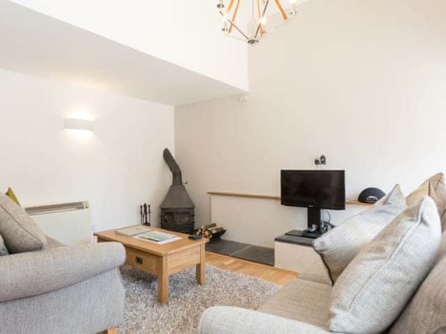 Cosy lounge with wood-burner | Torfield - Lower Elsford Farm, Lustleigh, near Bovey Tracey