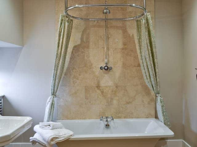 Bathroom with shower over bath | Sykelands Cottage - Sykelands Grange Cottages, Dalton near Richmond