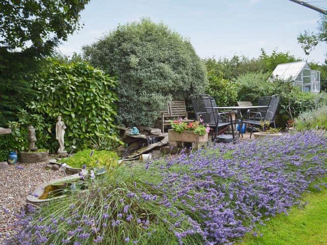 Shared, enclosed, lawned garden with sitting-out area and furniture | Sparrow&rsquo;s Nest, Wrangway, near Wellington