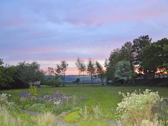 Enjoy breathtaking sunset views from the veranda and gardens | The Headmaster&rsquo;s Cottage, South Hill, near Tamar Valley