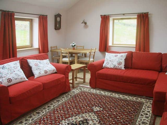 Comfortable living room with modest dining area | Peggy&rsquo;s Barn, Mallerstang, near Kirkby Stephen