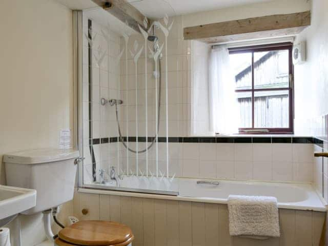 Family bathroom with shower over bath | The Byre, Newby, near Appleby-in-Westmorland