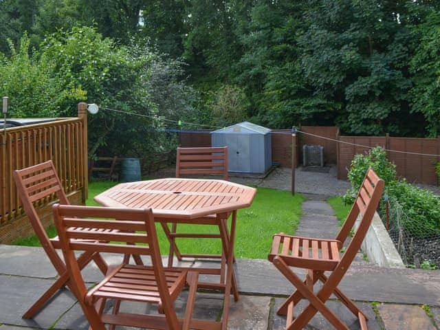 The sitting out area has a great vantage point over the large lawned garden | Briar Rigg, Keswick