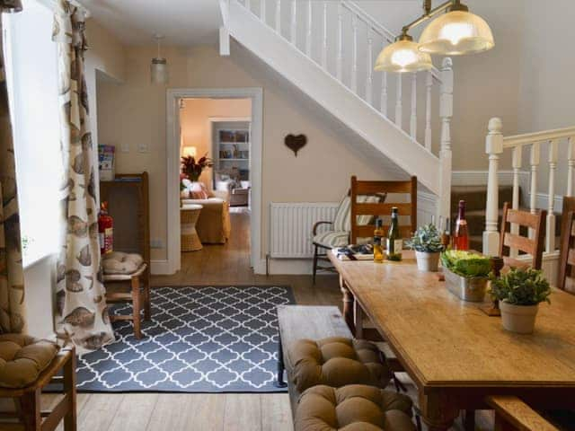 Dining room with welcome pack | The Garden Cottage - Thorpe Hall Cottages, Rudston, near Bridlington