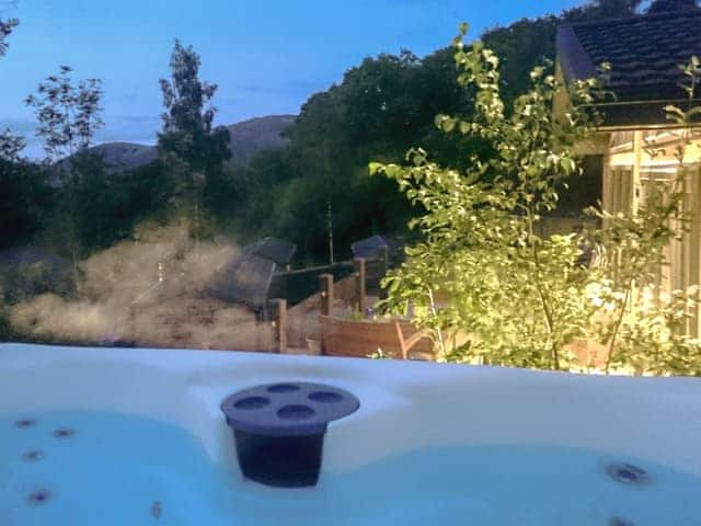 Hot tub at dusk | Lake Bank Lodge, Water Yeat, near Coniston