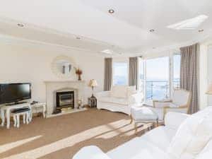 Sumptuous living/dining room with electric coal-effect fireplace | The Penthouse, Strone, near Dunoon