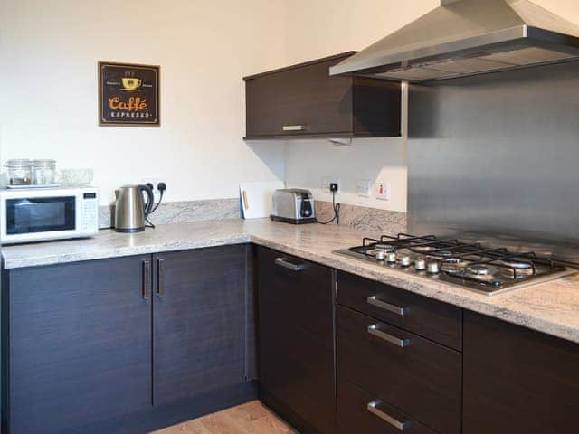 Kitchen with gas hob and electric oven | Puffin Place, Beadnell, near Seahouses