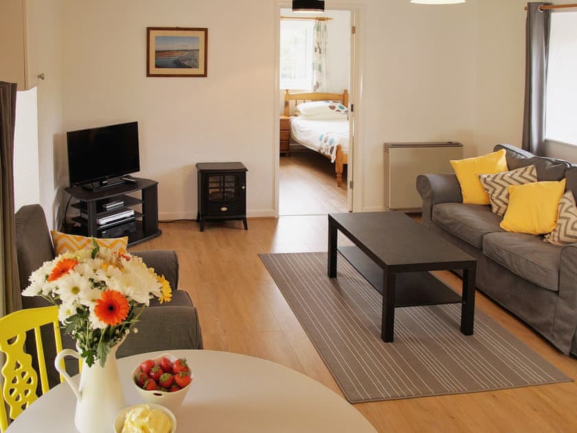 Open plan living area with comfy furniture | Yew - West Pusehill Farm, Westward Ho!, near Bideford