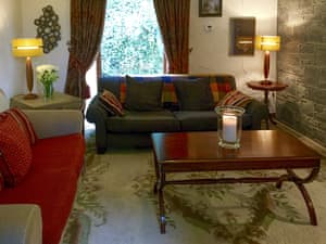 Stylish living room with exposed stone feature wall | Fruitpip, Over Haddon, near Bakewell