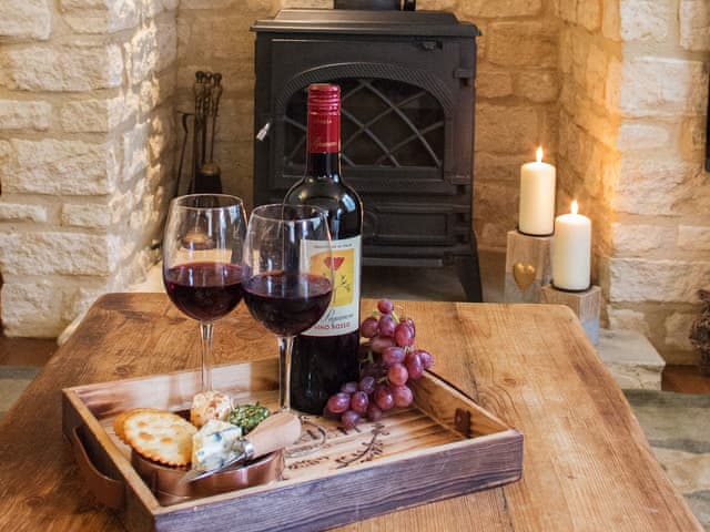 Relax in front of the lovely wood burning stove | Moorhens Cottage, Cotswold Water Parks