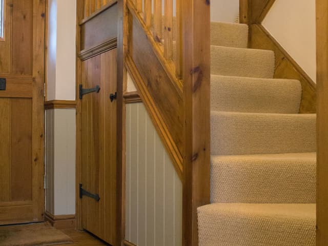 Lovely wooden turning staircase | Moorhens Cottage, Cotswold Water Parks