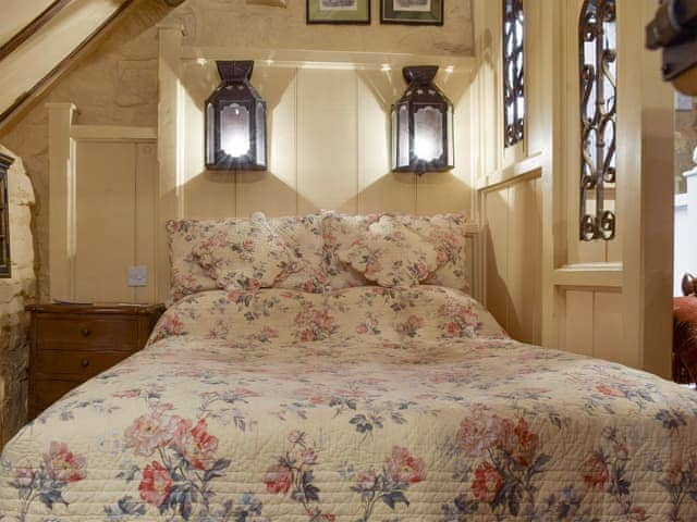 Partitioned sleeping area with comfortable double bed | The Hayloft - Red House Farm Cottages, Glaisdale, near Whitby