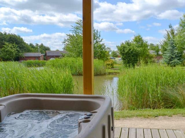 Relaxing hot tub with lovely views | Campbell Lodge, Thorpe on the Hill, near Lincoln