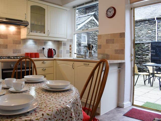 Well equipped kitchen/diner with access to the garden | Squirrel Cottage, Windermere