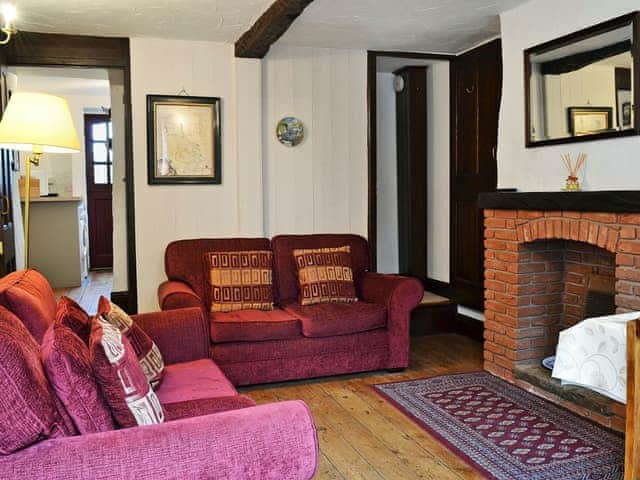 Warm and welcoming living room with beams | Michill Cottage, Castleton, near Buxton