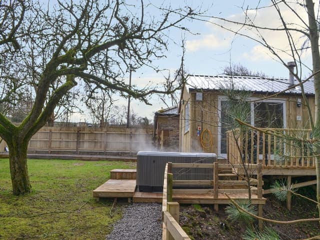 Balcony with outdoor furniture and hot tub | Treehouse Cabin - Wallace Lane Farm Cottages, Brocklebank, near Caldbeck and Uldale