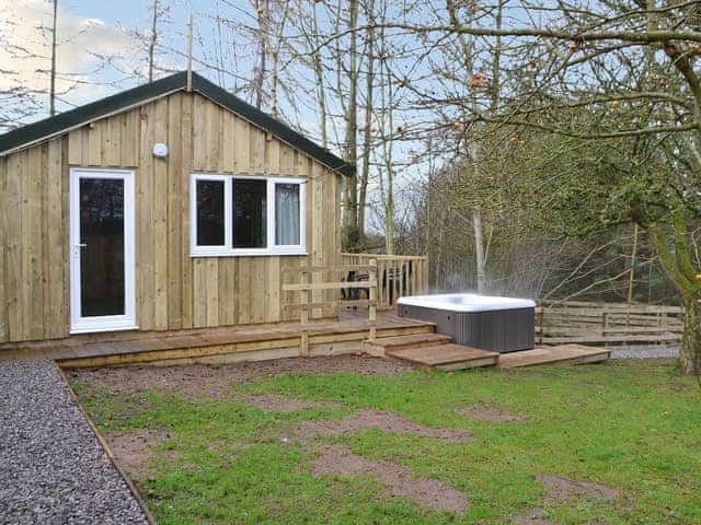 Lawned garden area to front of property | Treehouse Cabin - Wallace Lane Farm Cottages, Brocklebank, near Caldbeck and Uldale