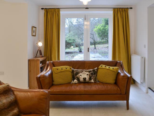 Living area with French doors | The Coach House, White Moss, near Grasmere