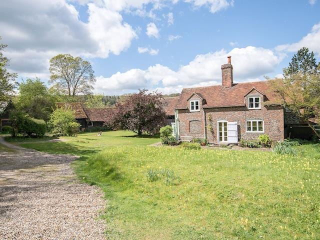 Adjacent to the owners brick and flint farmhouse | Pheasants Hill Old Byre, Hambleden, near Henley-on-Thames