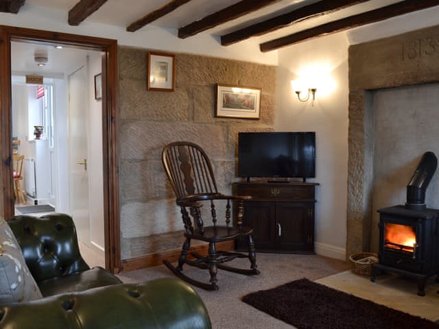 Cosy living room with wood burner | Wild Flower Cottage, Youlgreave, near Bakewell
