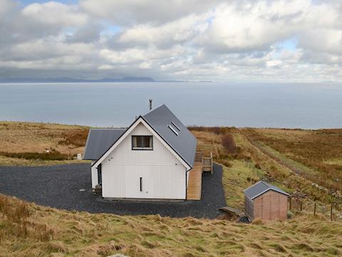 Located in a rural location overlooking the sea a short stroll from the beach | Fionn Croft Lodge, Melvaig, near Gairloch