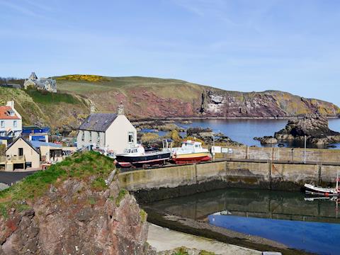 The property is set on the edge of the pretty harbour of St Abbs | Rock Cottage, St Abbs, near Eyemouth