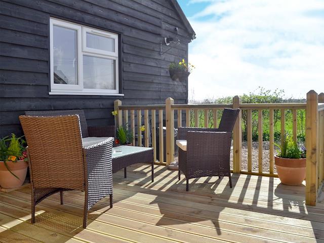 Delightful decking area | Reed Lodge - Wood Fen Lodges, Little Downham, near Ely