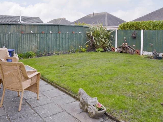 Enclosed rear lawned garden | Rossall Beach Cottage, Rossall, near Thornton-Cleveleys.