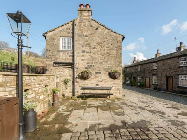 York-stone patio at street level | Narrowgates Cottage, Barley, near Barrowford