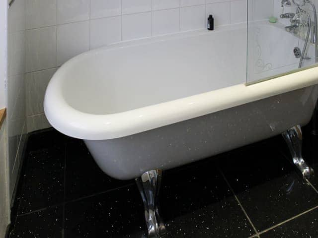 Bathroom with claw foot bath and shower attachment | Glaramara, Kendal