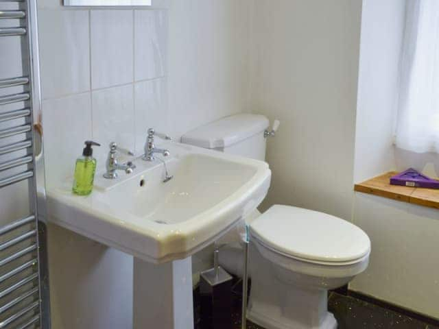 Bathroom with claw foot bath and shower attachment | Glaramara, Kendal