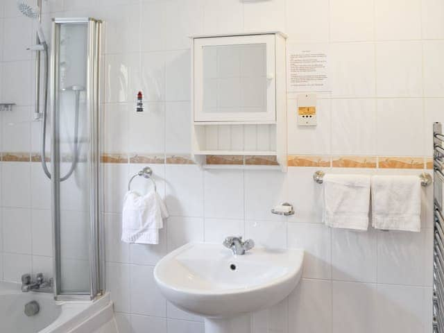 Bathroom with under-floor heating and large heated towel rail. | Villa 55, Cromer