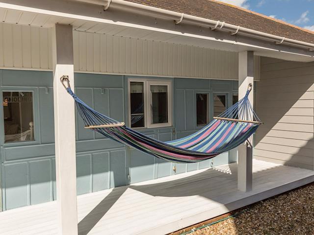 Relaxing hammock in decked patio area | Southern Bell, Hayling Island