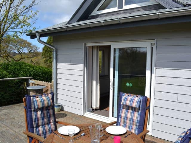 Sunny decked area with table and chairs | Sunny Skies - Little Crugwallins, St Austell