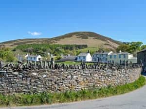 Grade II listed detached cottage located in the heart of the village of High Lorton within the Lake District National Park | Corner House, High Lorton, near Cockermouth