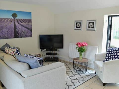 Beautifully decorated living room with French doors | Pond Cottage, Sedgehill, near Shaftesbury 