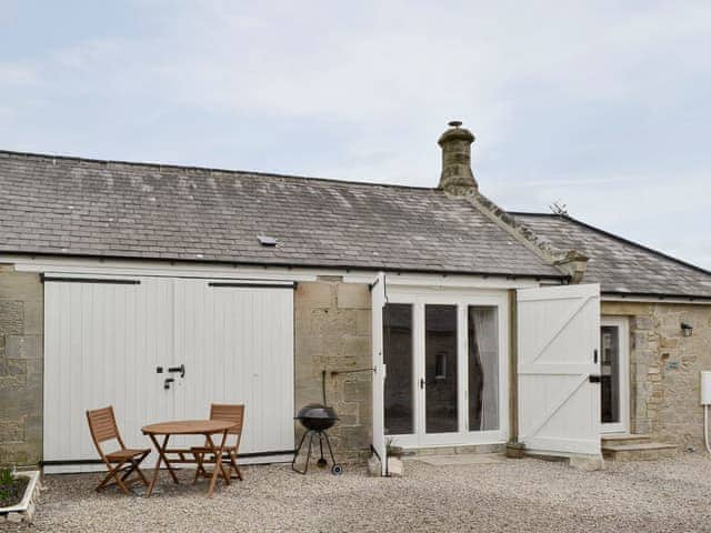 Gravelled courtyard with outdoor furniture | The Coach House - The Grange, Whittingham near Alnwick