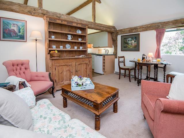 Delightful living space with exposed beams | Pheasants Hill Old Byre, Hambleden, near Henley-on-Thames