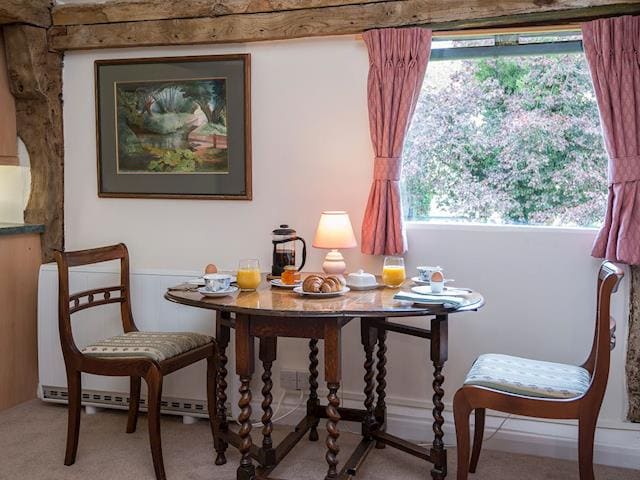 Lovely intimate dining area | Pheasants Hill Old Byre, Hambleden, near Henley-on-Thames