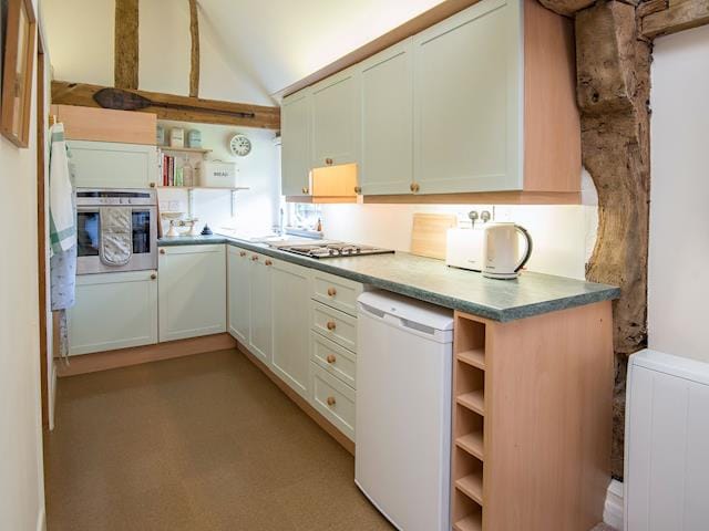 Charrming galley style kitchen | Pheasants Hill Old Byre, Hambleden, near Henley-on-Thames