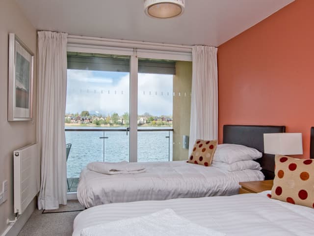 Twin bedroom with balcony | The Augusta House, Somerford Keynes