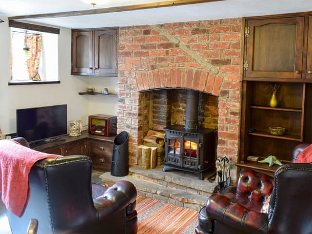 Dining room with sitting area leading to kitchen | Hope Cottage, Whitby